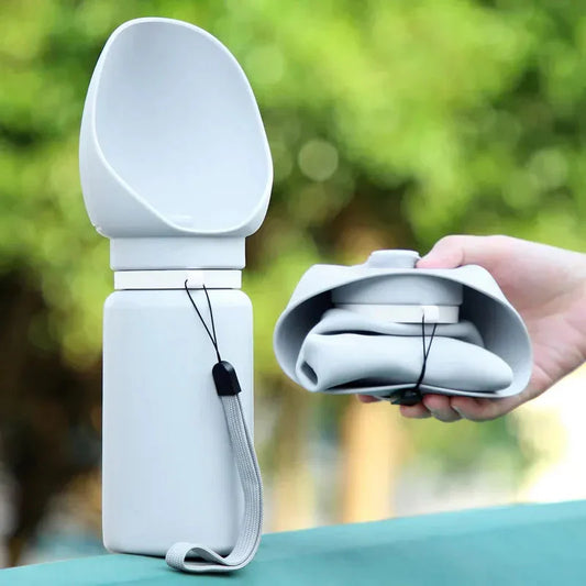 Folding Pet Water Dispenser with leak-proof design, silicone foldable storage, and 550ml capacity for outdoor dog hydration.